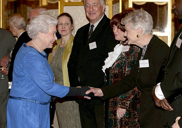 Queen Elizabeth II meets guests, including Dame Angela Lansbury (R) and Lynda La Plante (2ndR), during the Dramatic Arts reception at Buckingham Palace on February 17, 2014 in London, England. Photo Credit: Yui Mok - WPA Pool/Getty Images