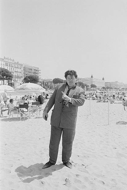 Actor Robbie Coltrane on the beach during the Cannes Film Festival, France, May 1986. Photo Credit: Richard Blanshard/Getty Images