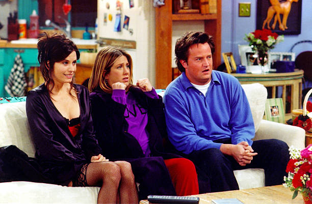 Courteney Cox Arquette (L), Jennifer Aniston (C) and Matthew Perry are shown in a scene from the NBC series "Friends". The series received 11 Emmy nominations, including outstanding comedy series, by the Academy of Television Arts and Sciences July 18, 2002 in Los Angeles, California. Photo Credit: Warner Bros. Television/Getty Images