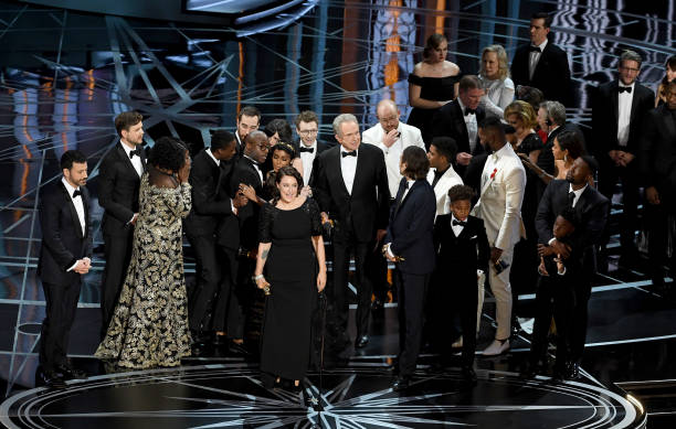 Producer Adele Romanski (C), writer/director Barry Jenkins, producer Jeremy Kleiner and cast/crew members accept Best Picture for 'Moonlight' onstage during the 89th Annual Academy Awards at Hollywood & Highland Center on February 26, 2017 in Hollywood, California. Photo by Kevin Winter/Getty Images