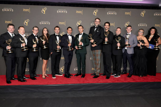 (L-R) Josh Drisko, Jeff Luini, Alan Bloom, Sarina Roma, Dane Lillegard, Nick Frenkel, Rob McElhenney, Humphrey Ker, Milos Balac, Aaron Lovell, Patrick McGarvey, Shannon Owen and Liz Spano, winners of the Emmy for Outstanding Unstructured Reality Program for Welcome to Wrexham, attend the 76th Creative Arts Emmys Winner's Walk at Peacock Theater on September 07, 2024 in Los Angeles, California. Photo by Amy Sussman/Getty Images