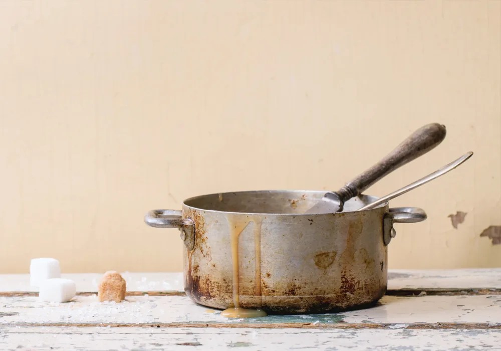 Why are my pots stained and how can I remove them?