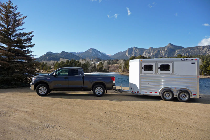 "Toyota Tundra and towing a Cimarron horse trailer and Titan