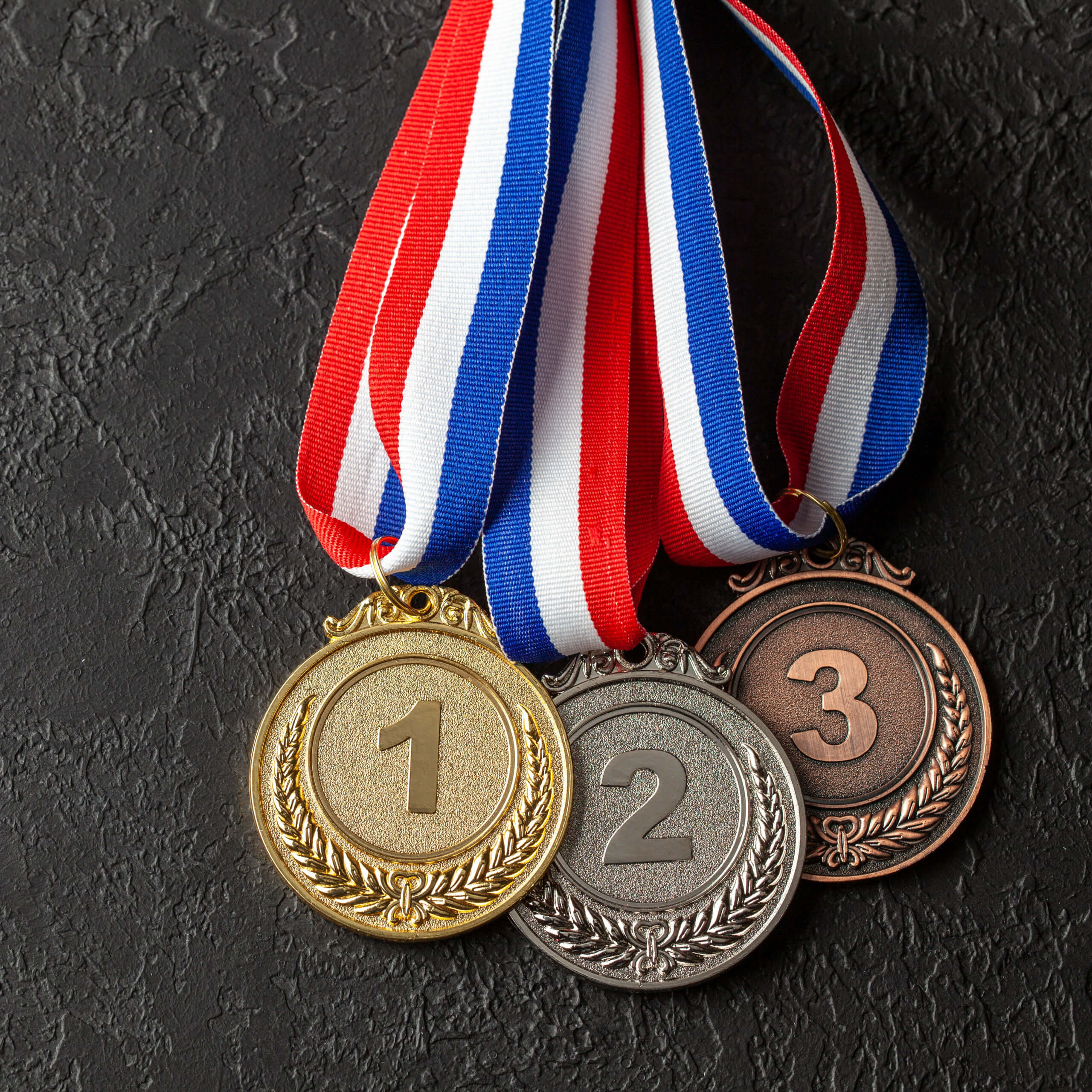 Gold, silver and bronze medal with ribbons. Award for first, sec