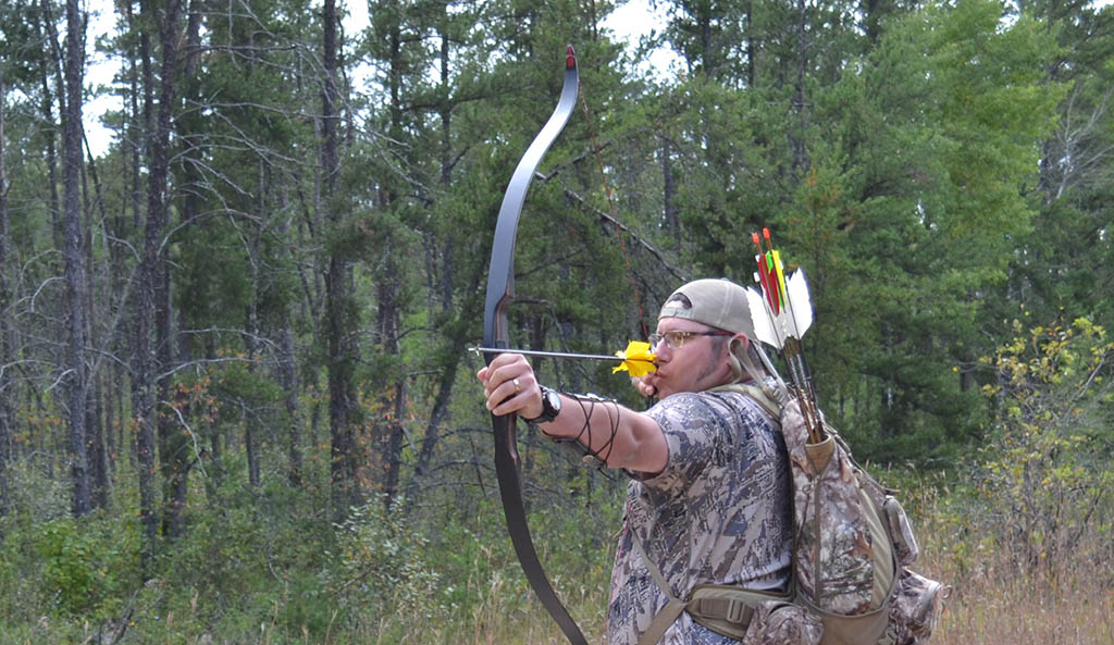 Stump Shooting Fun with a Traditional Bow Manitoba Wildlife Federation