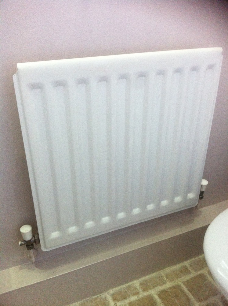 Supply & fit small towel radiator in the cloakroom Plumbing job in