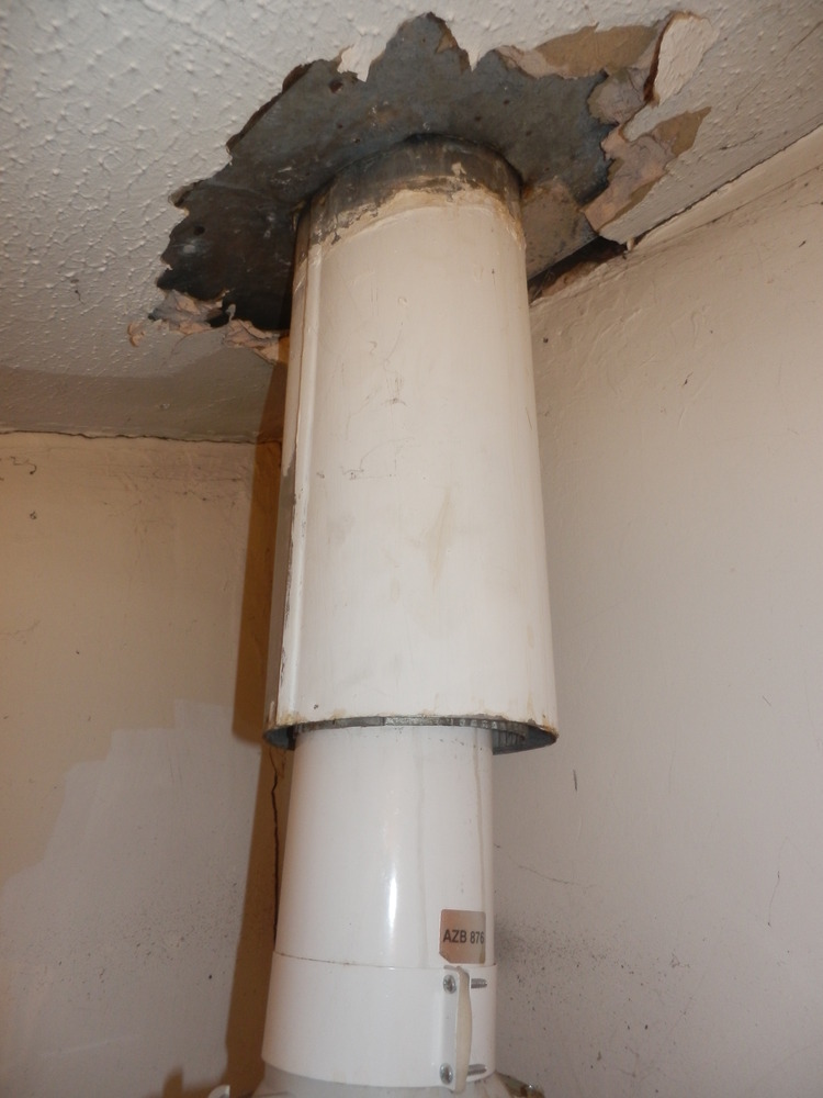 Remove old flue from boiler and make good Central Heating job in