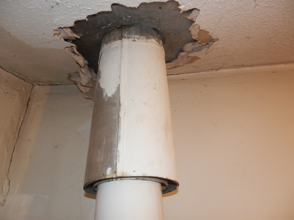 Remove old flue from boiler and make good Central Heating job in