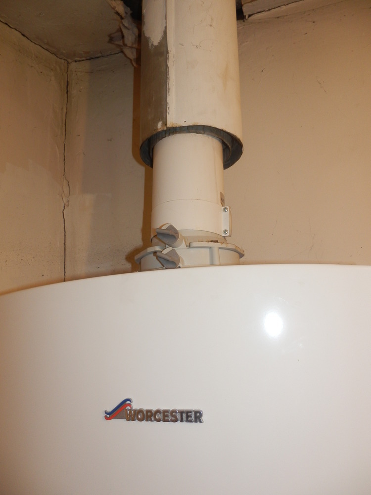 Remove old flue from boiler and make good Central Heating job in