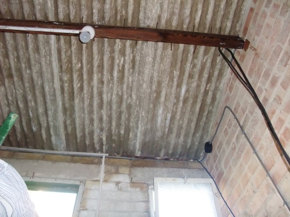 Remove & replace corrugated asbestos outhouse roof Roofing job in