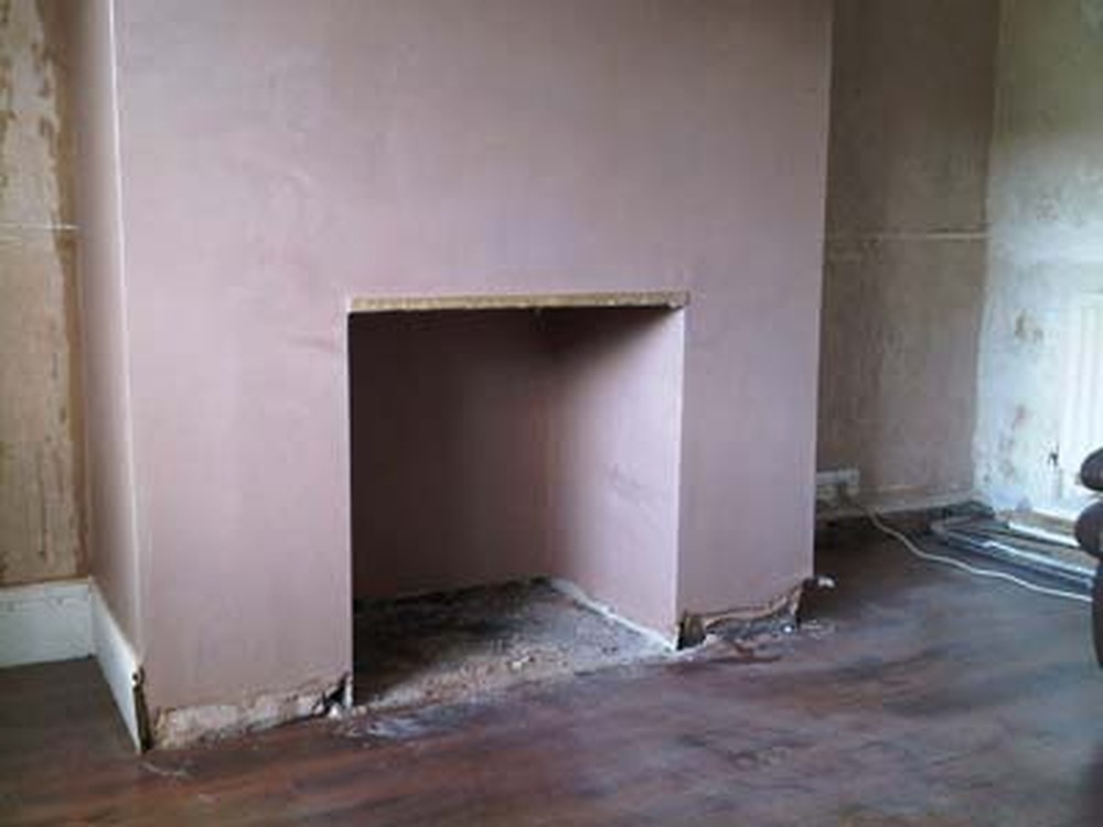 Plaster Stone Clad Fireplace Plastering job in Peterborough