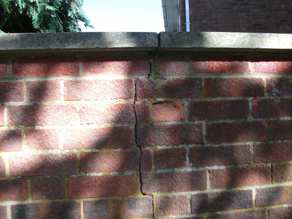 Repair crack in brick garden wall. Bricklaying job in Bedford