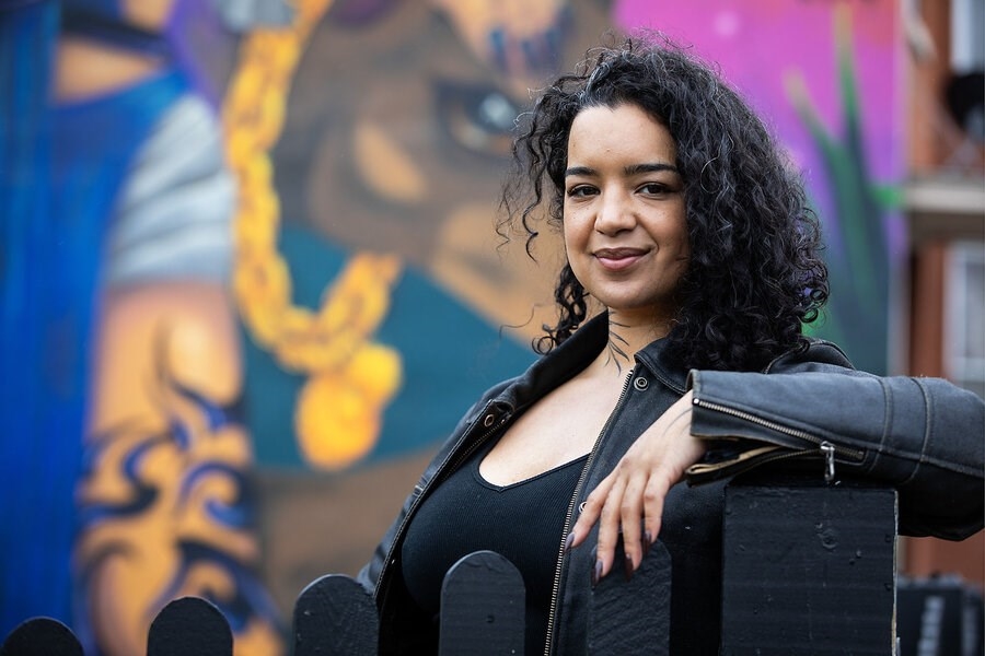 This Boston artist creates murals that have a message ‘We’re still