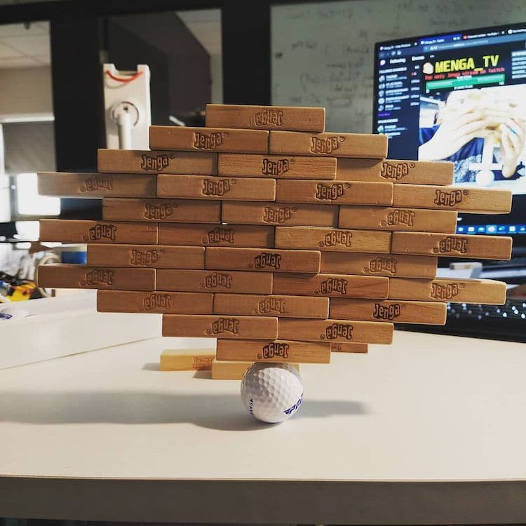 Guy Breaks His Own World Record for Balancing 1,512 Jenga on One