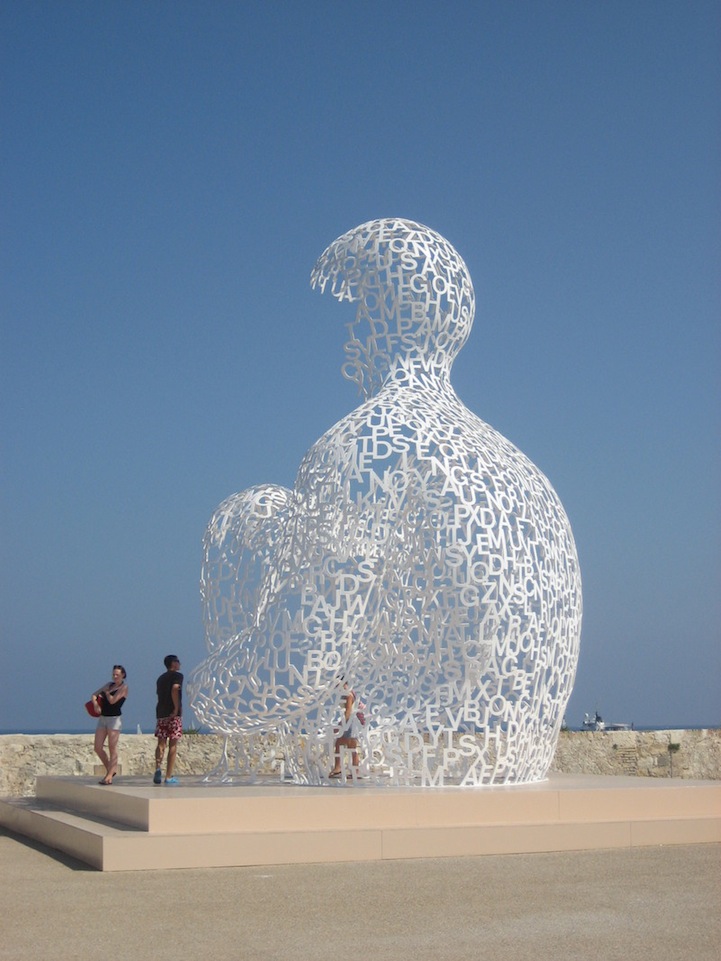 Giant Sculpture of a Man Made of Letters