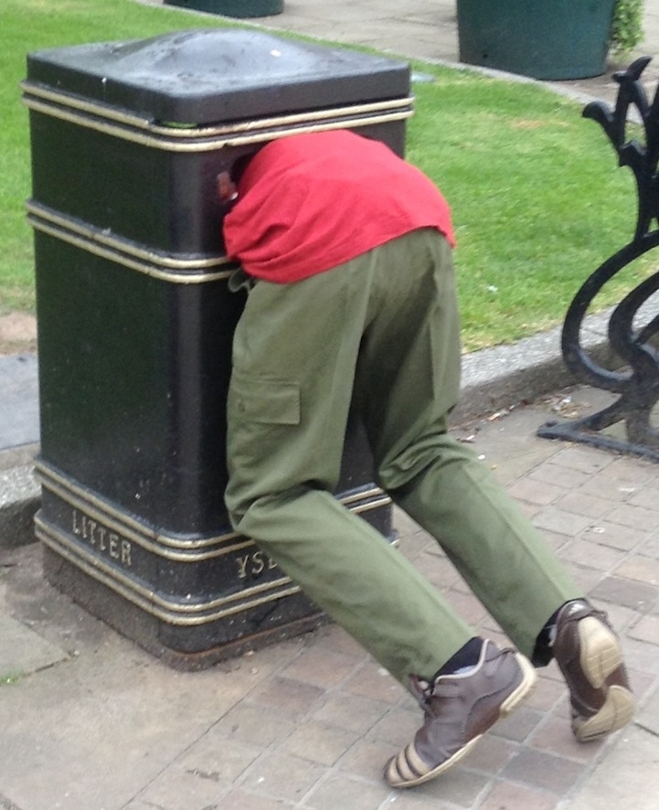 Public Sculptures Look Like People Stuck in Trash Bins