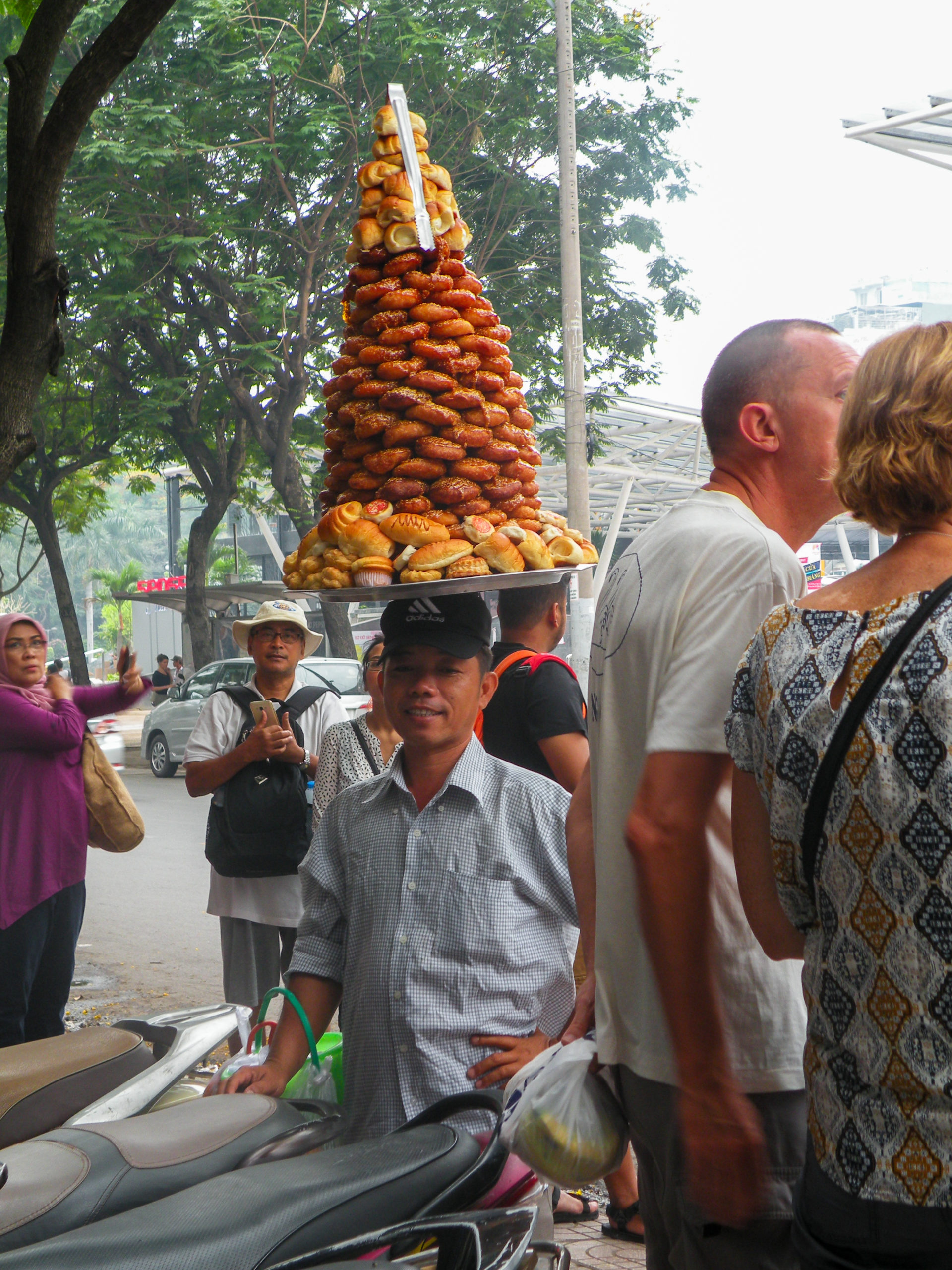 Man with bread on his head