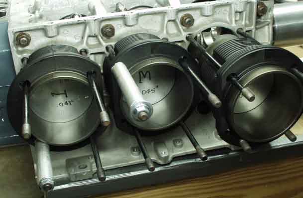 The cylinder shims are squished into the bead and another bead is applied.