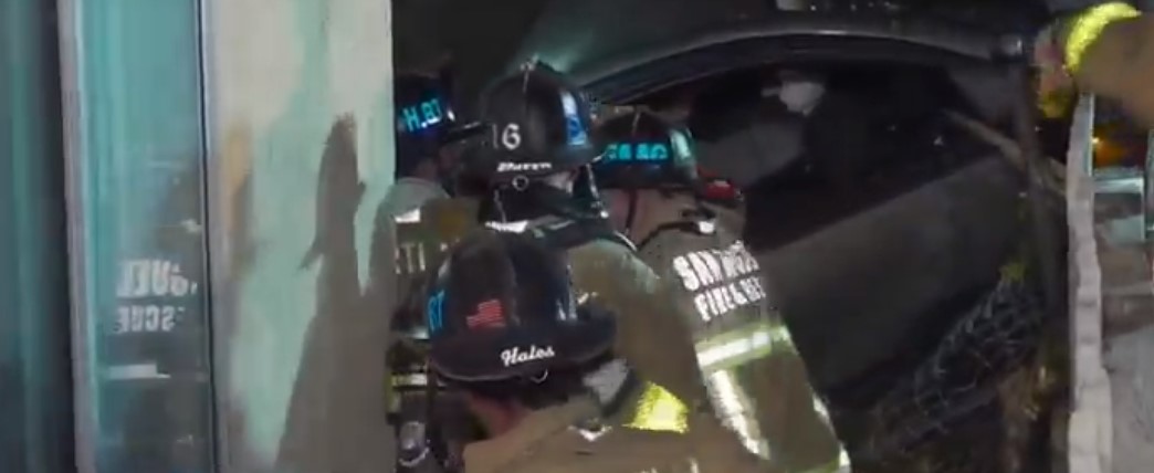 Driver Trapped Inside Their Vehicle Is Rescued After Crashing In A