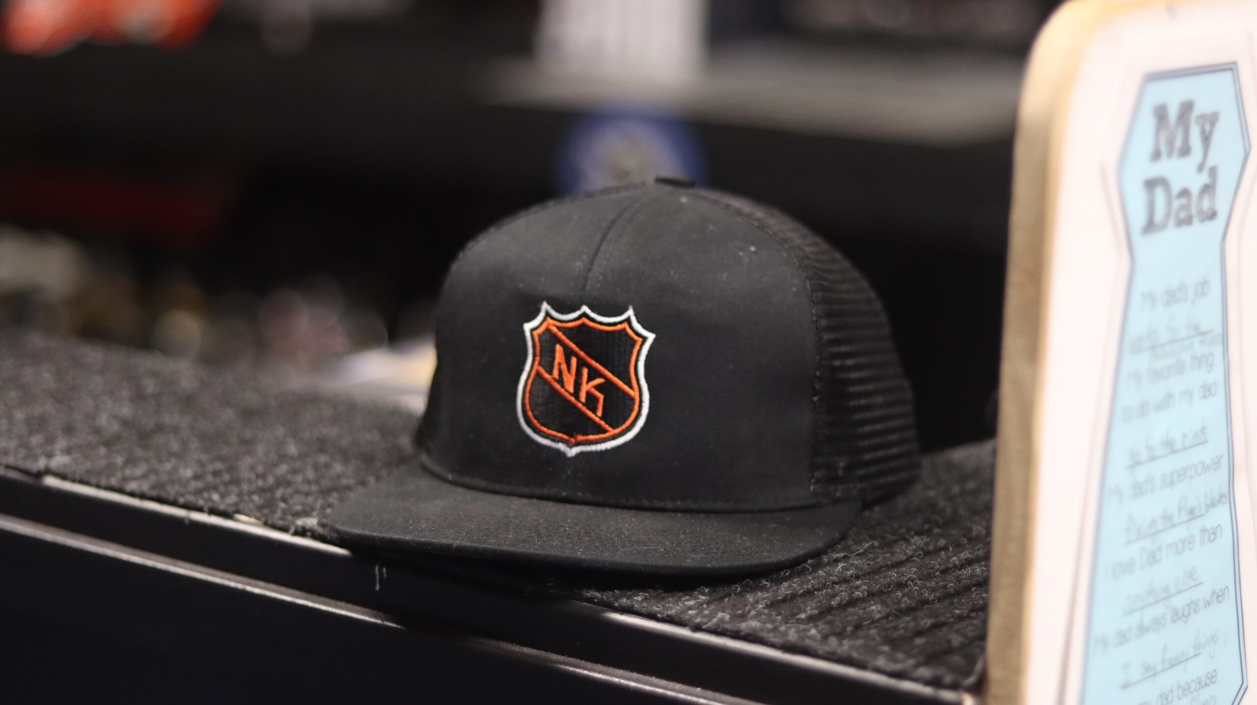 NASTY KNUCKLES BLACK HAT WITH NHL SHIELD Behind the scenes NHL