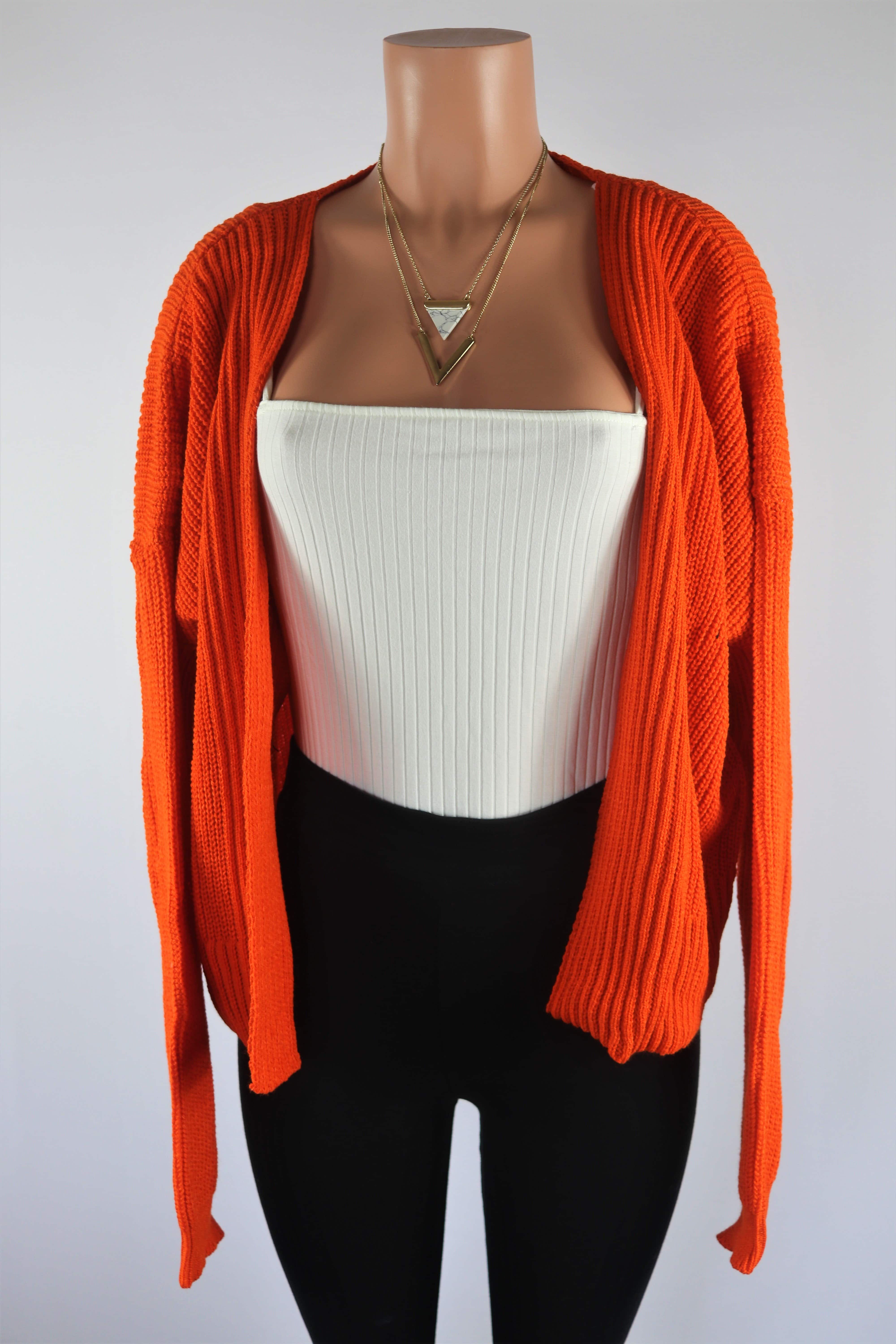 Orange Cardigan Burnt orange cropped long sleeve knitted cardigan.