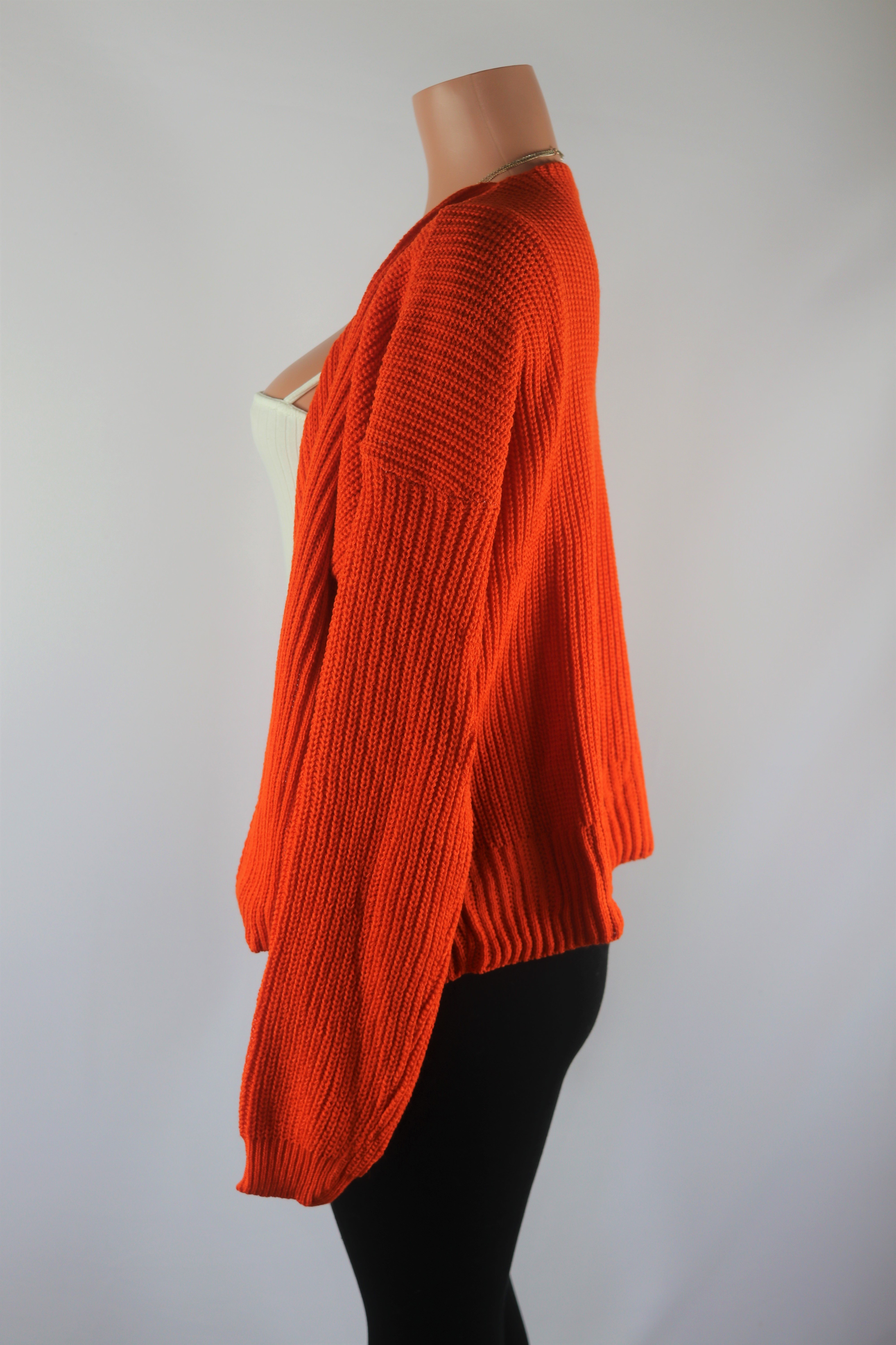 Orange Cardigan Burnt orange cropped long sleeve knitted cardigan.