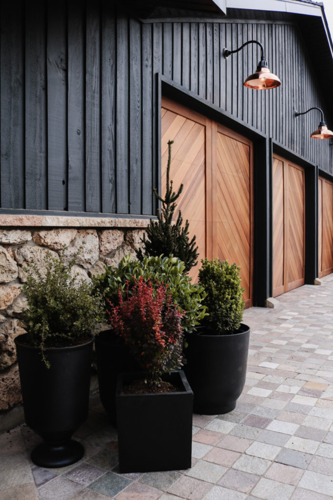 Wood Garage Doors and Copper Exterior Lights Over Doors Nesting With