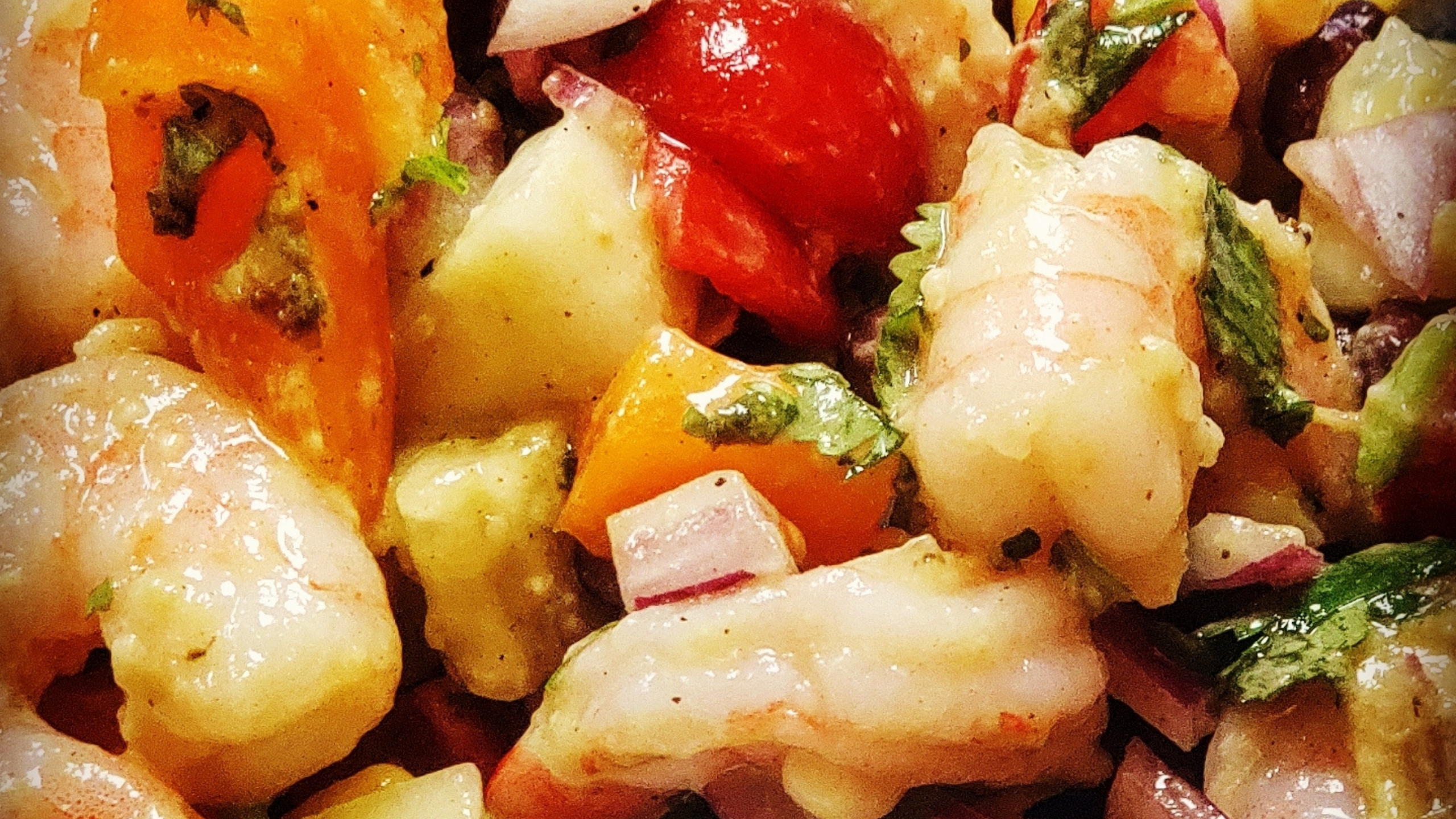 cilantro, lime, shrimp, corn, black beans, cucumbers, cherry tomatoes, red onion, and avocados in a lime vinagrette dressing make up this delicious cilantro shrimp salad