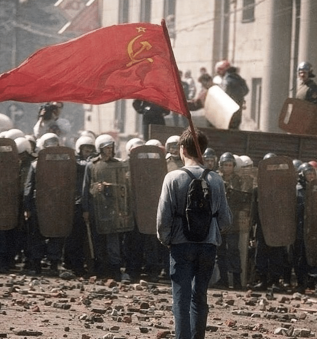 Meme Generator Kid with communist flag in front of riot police