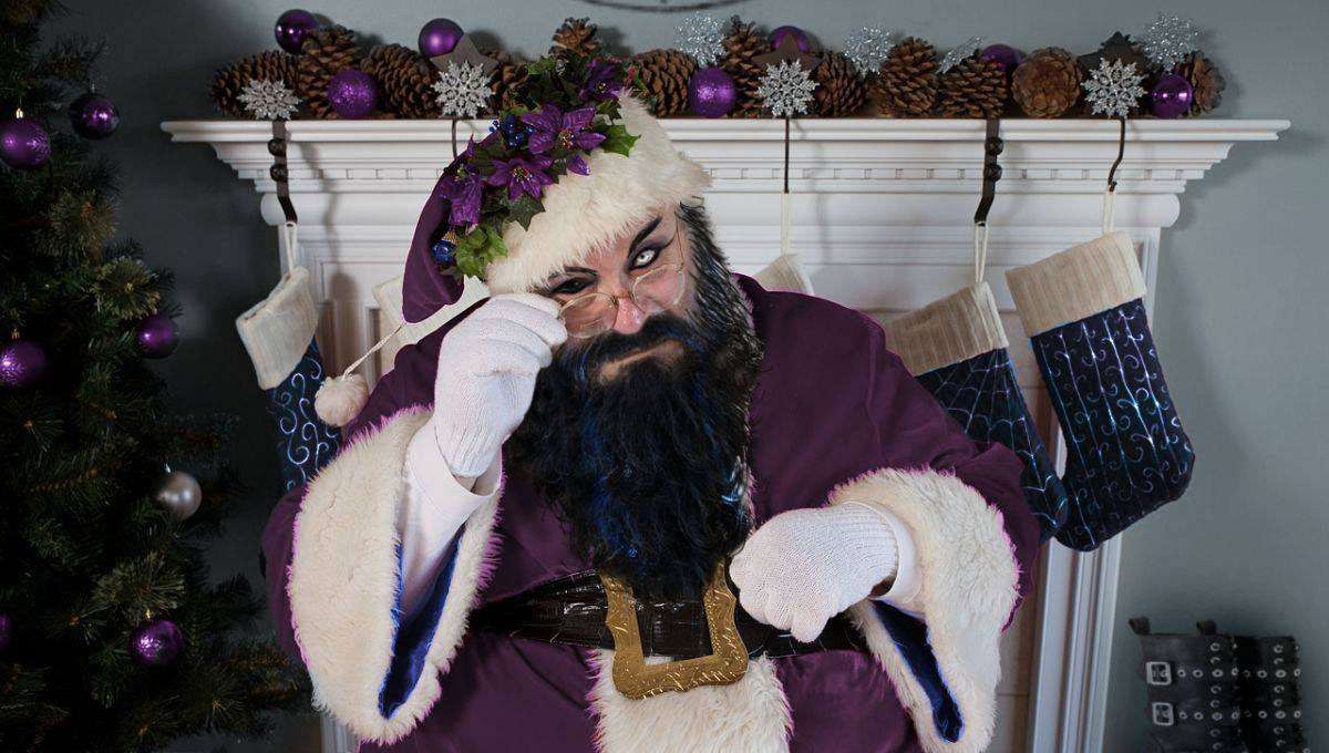 Goth Father Christmas making sure everyone on his list is naughty