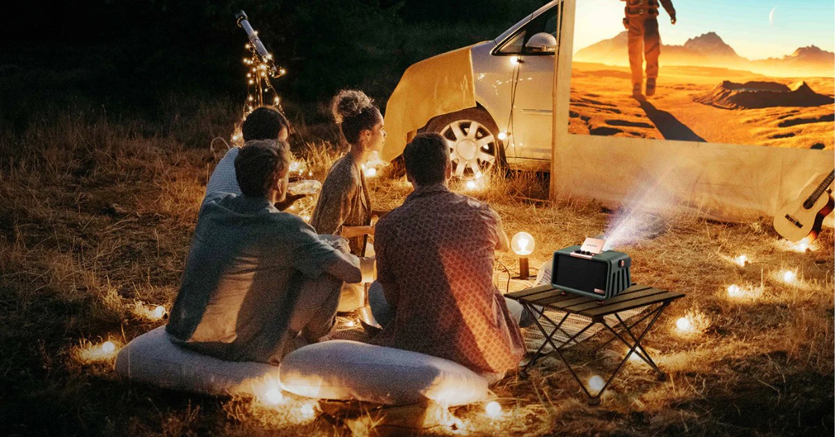 Setting up the camping projector for a perfect outdoor movie night