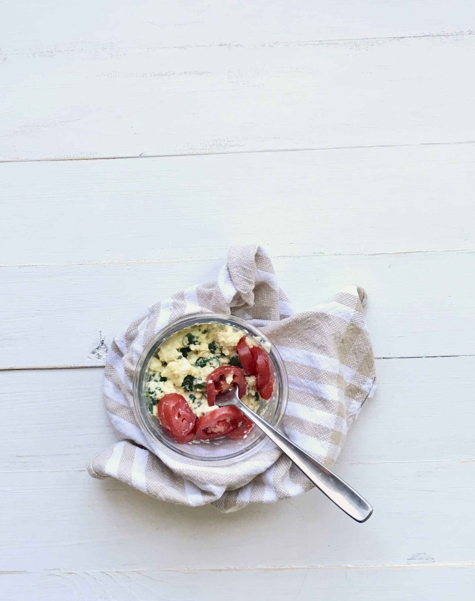 quick microwave scrambled eggs with cheese, spinach, and tomato
