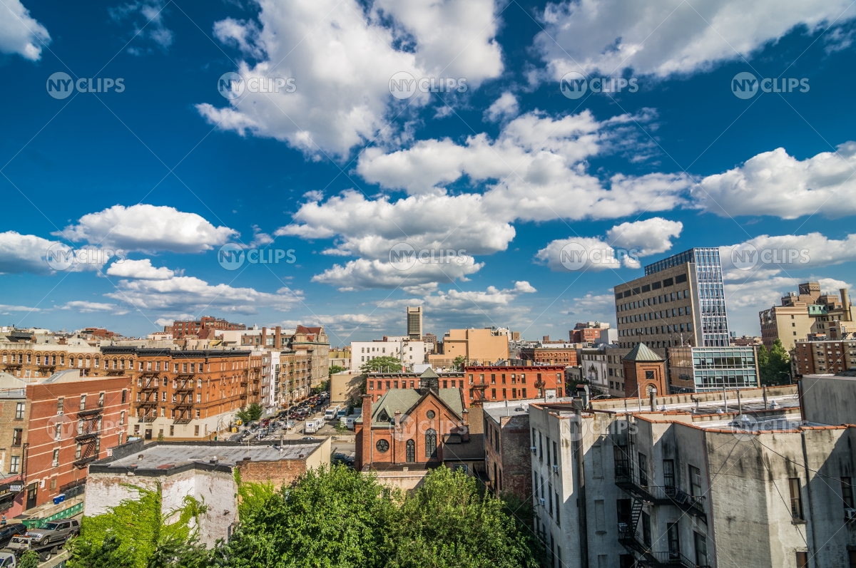 Harlem neighborhood with church from rooftop on bright beautiful sunny