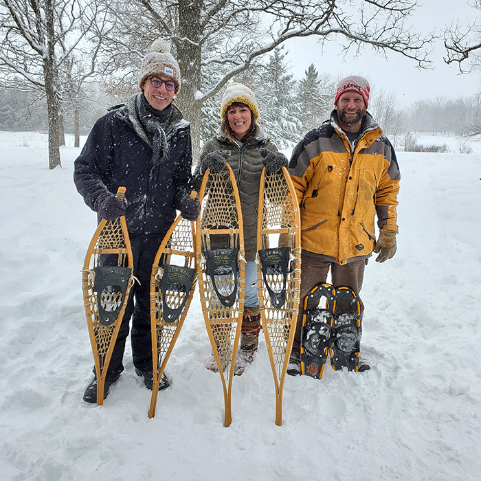 Cory Hepola stands next to Nick and Betsy Roder and with a couple pairs