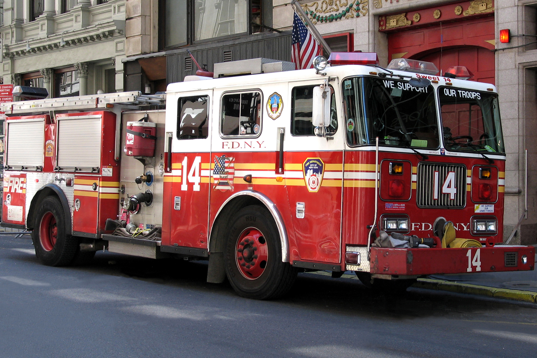 Fire truck blows tire and shatters store window