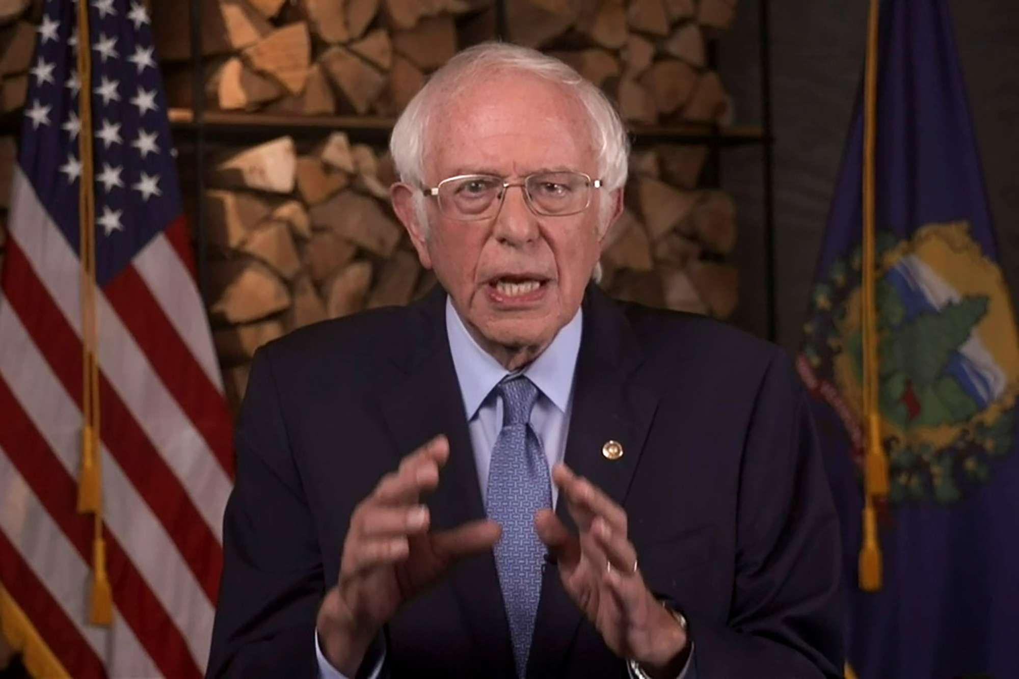 Bernie Sanders urges supporters to join him in backing Joe Biden at DNC