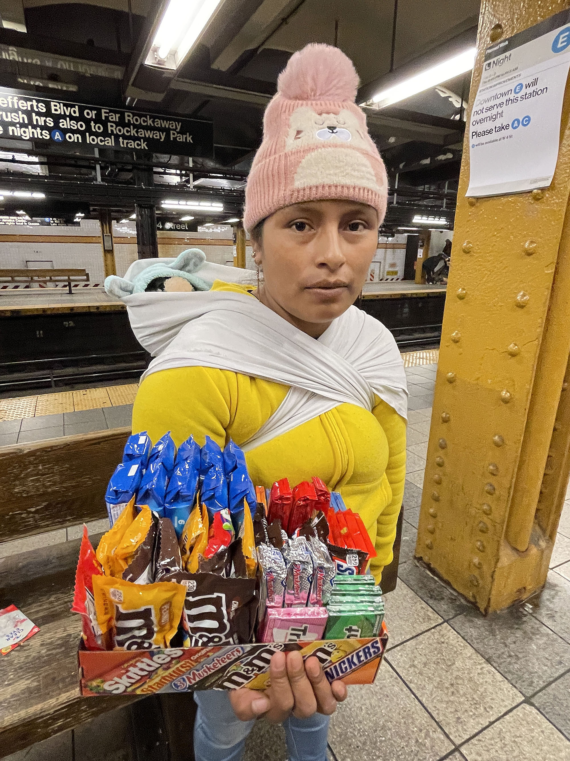 Exclusive Migrants sell 2 candy bars in subway to scrape by