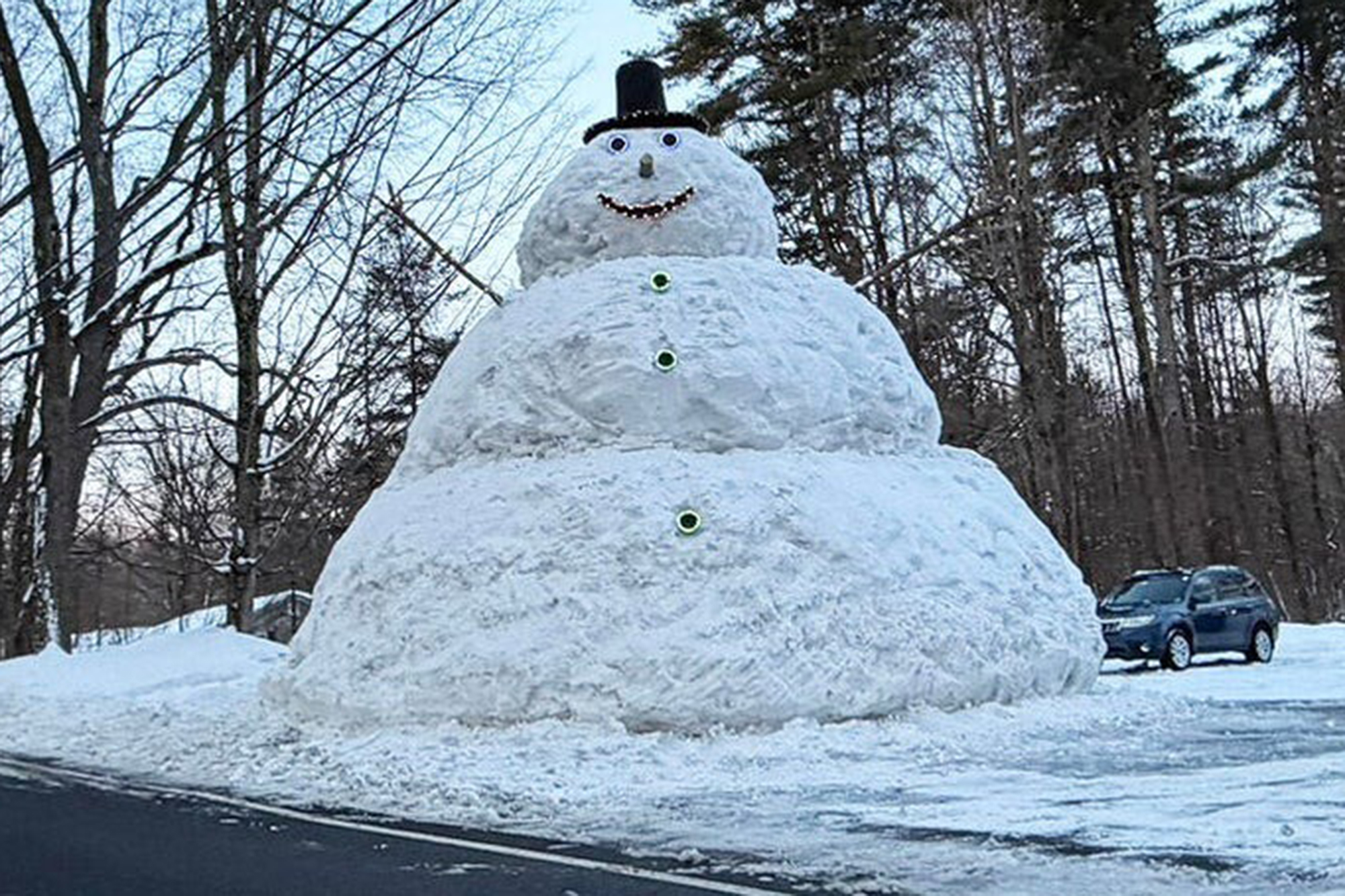 Massachusetts family’s hulking snowman grows to 23-feet tall after weekend blizzard