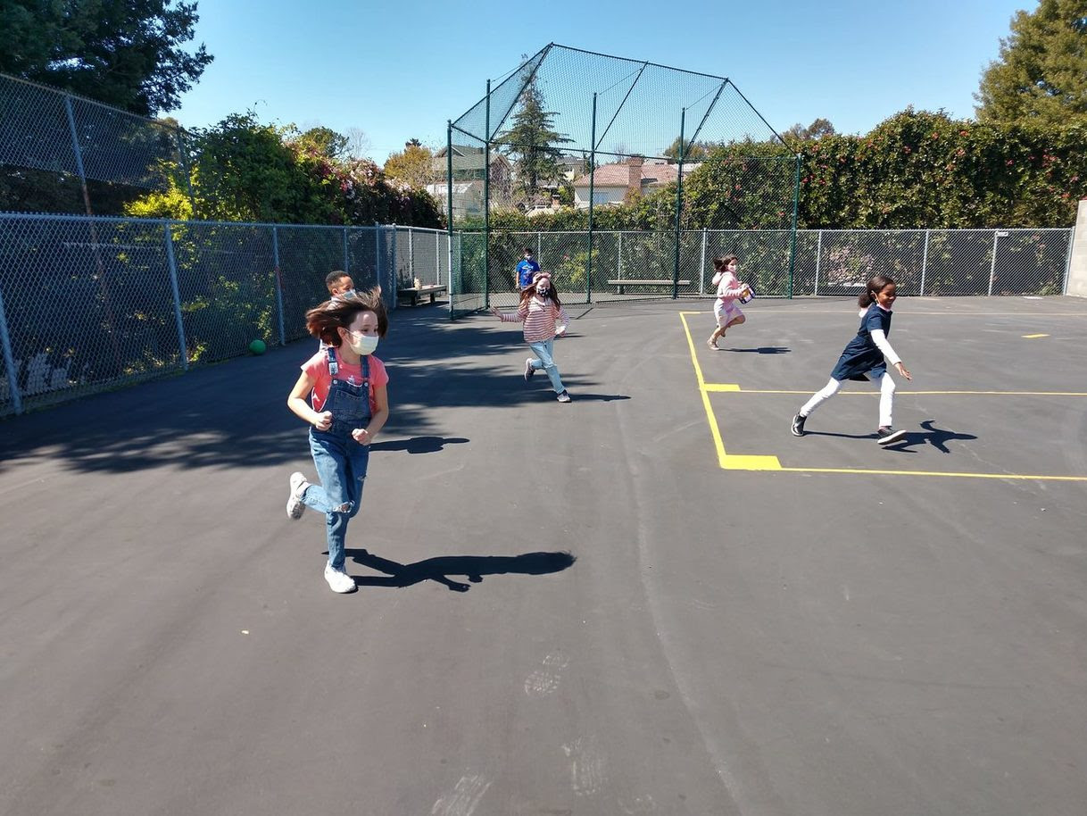 kids running on a court