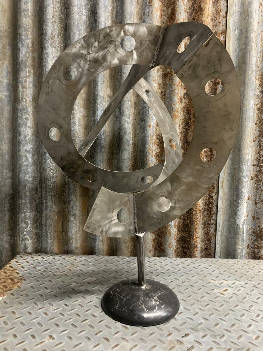 "Holes in time" (Original art by Metal Sculptures by Shawn Corder)