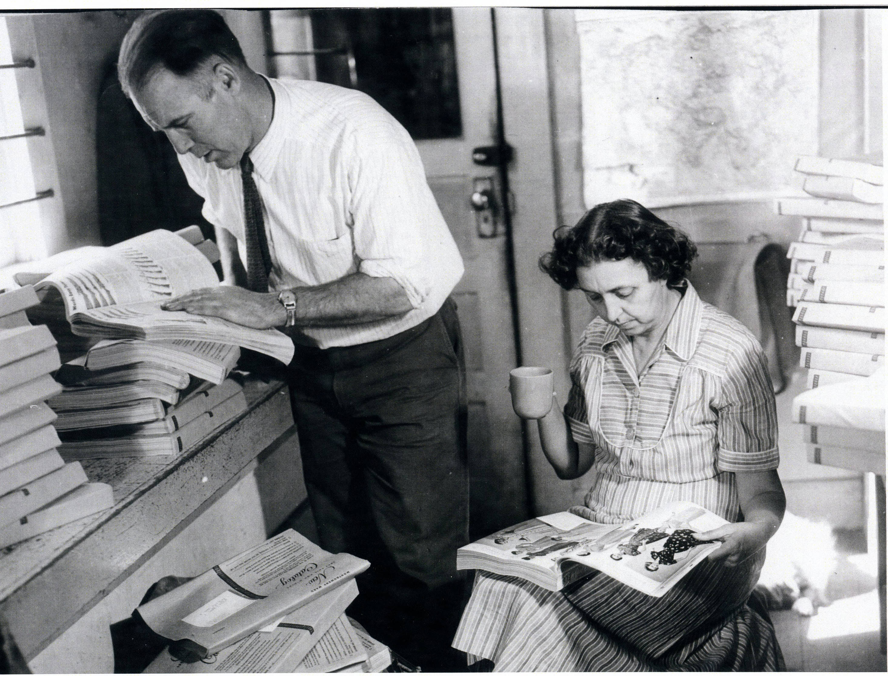 Alec and Margaret Bull looking at the newest Sears Roebuck catalog at