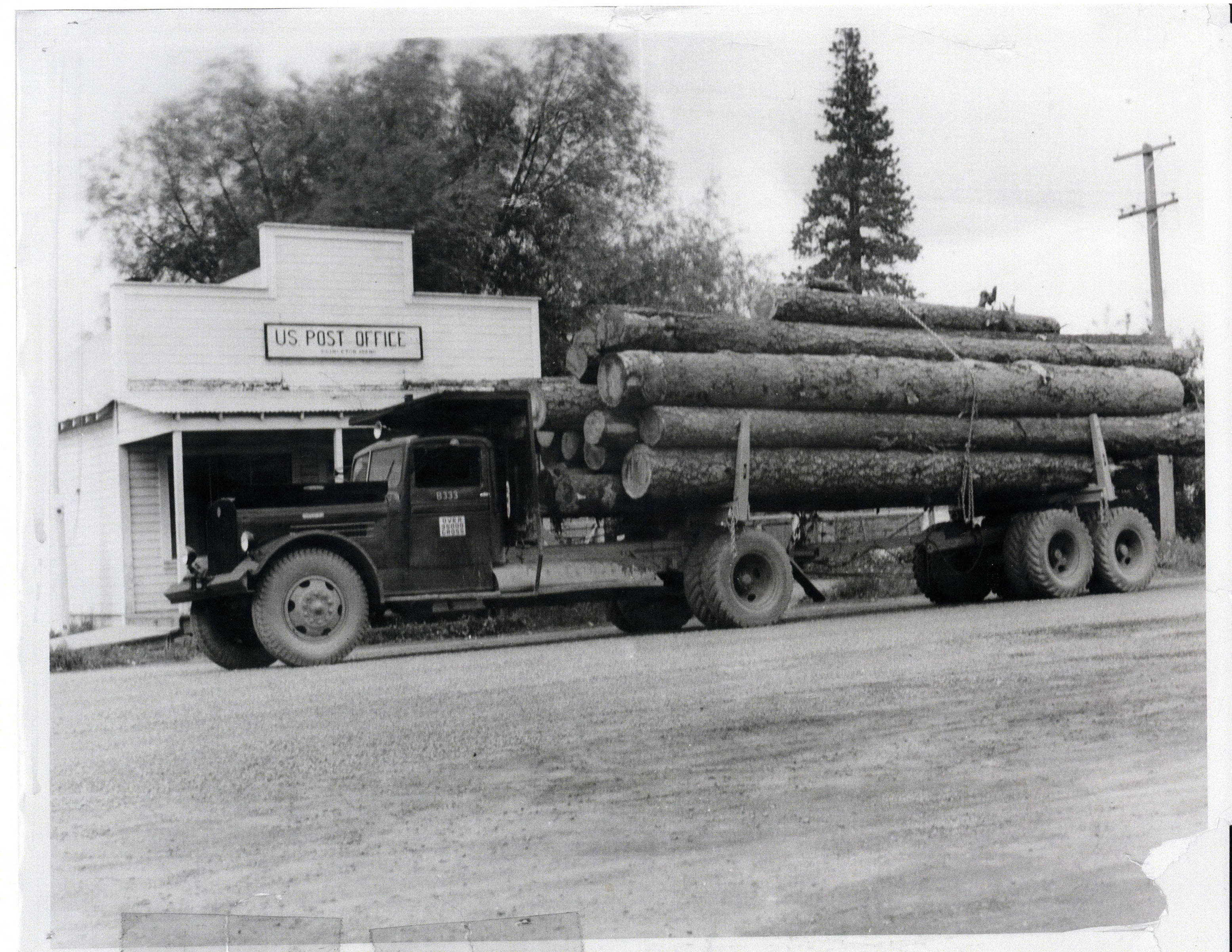 Truck with logs stopped at Princeton on way to Potlatch Mill Potlatch