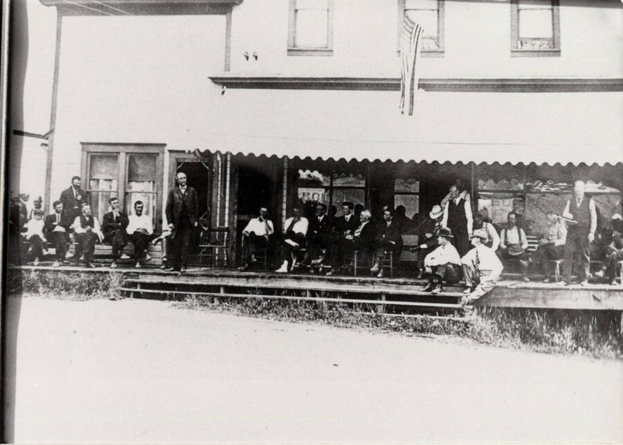 Gathering on the porch of the Carlson Hotel in Deary, Idaho The Trees