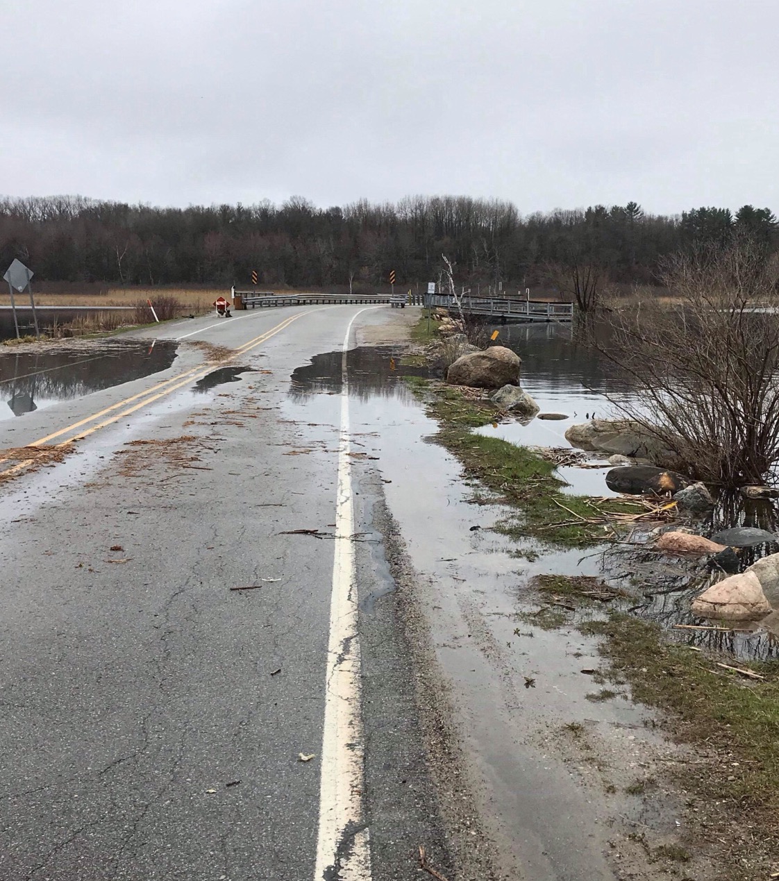 Rising waters on Pentwater Lake force road closure.