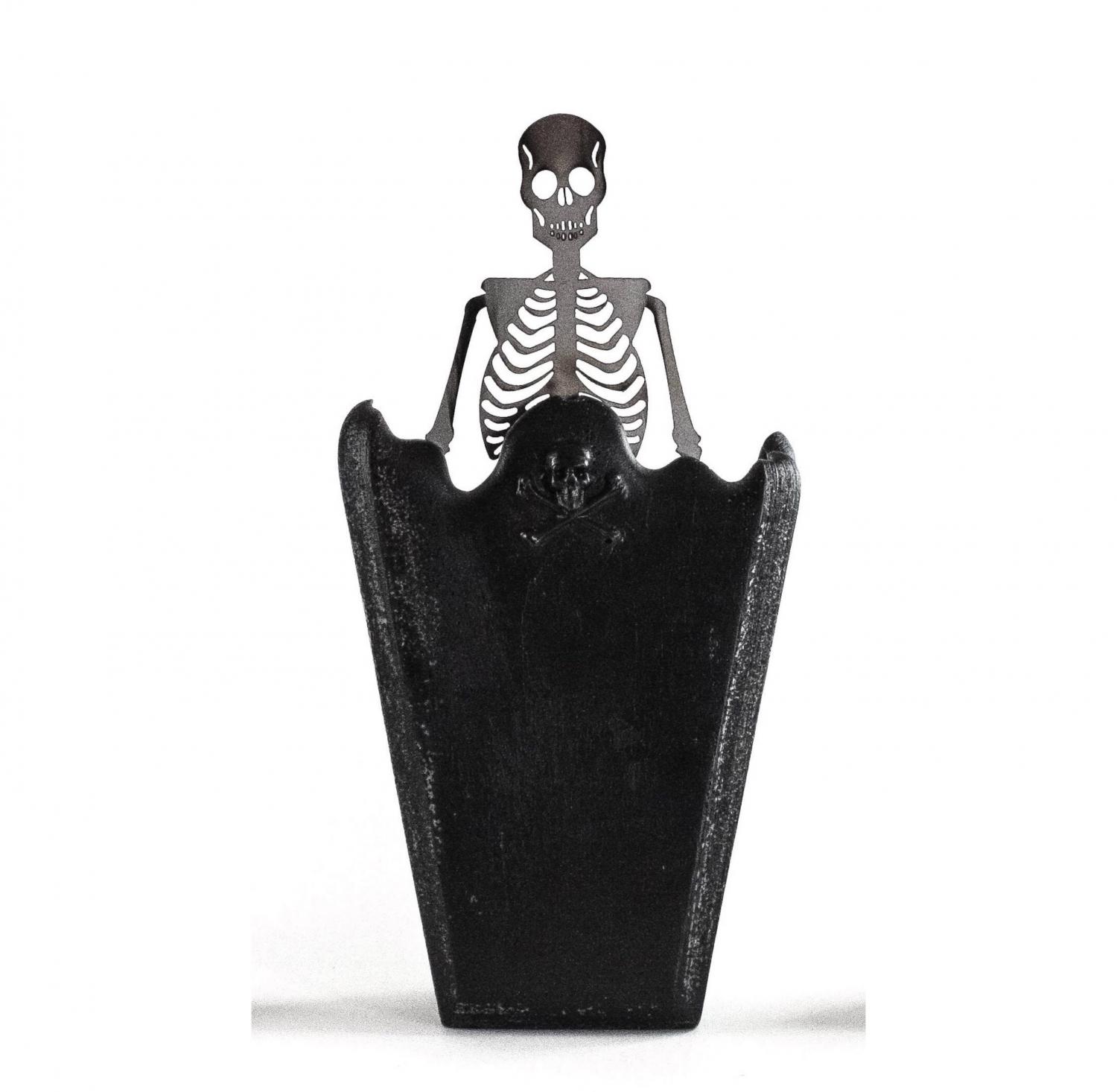 This Coffin Candle Melts To Reveal a Skeleton Inside