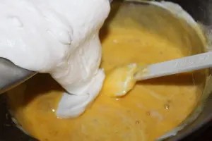 Combine mixtures by folding whipped mixture into the custard.