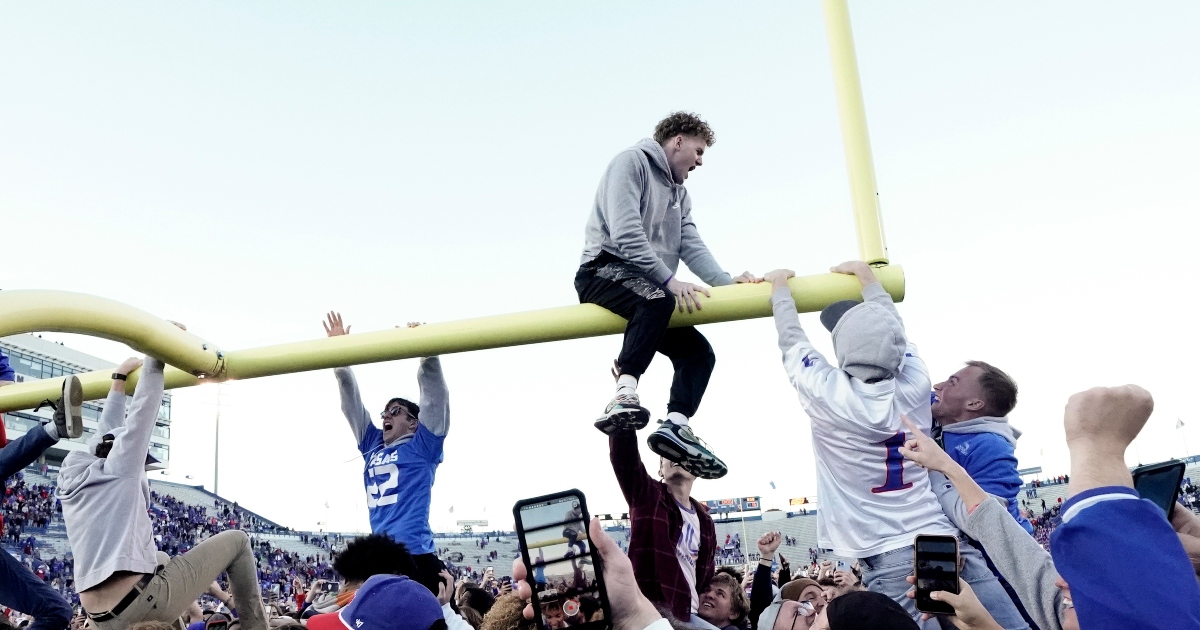 WATCH Kansas fans toss goal post in lake to celebrate bowl
