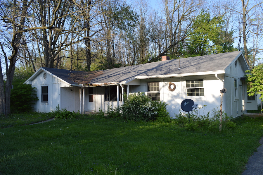 front of abandoned country home in rural ohio white Once Occupied