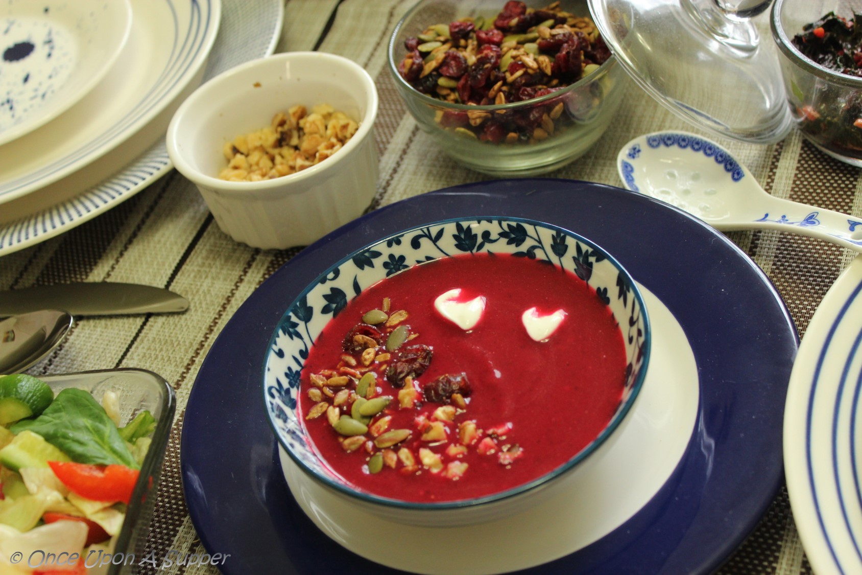 Soulful ABC soup Apple, Beetroot and Carrot soup, topped with roasted seeds, dry cranberries