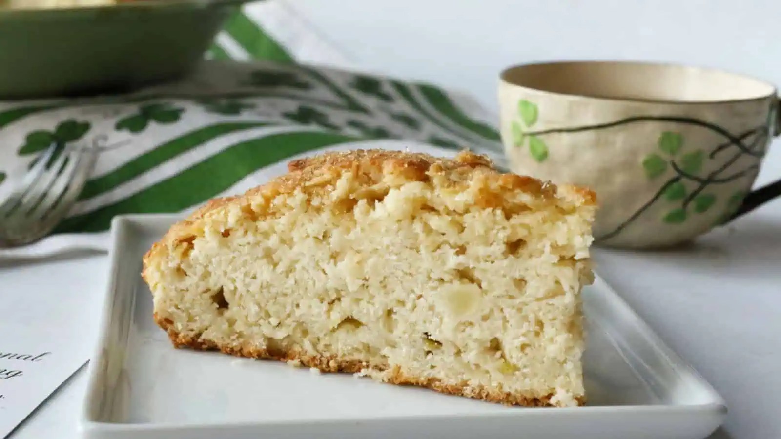 Apple cream scones on a white plate.